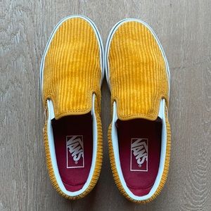Yellow corduroy slip-on vans